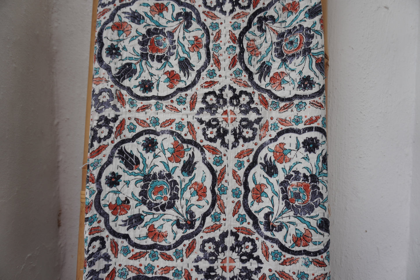 Kantha Quilt in white with RUST AND NAVY FLORALS