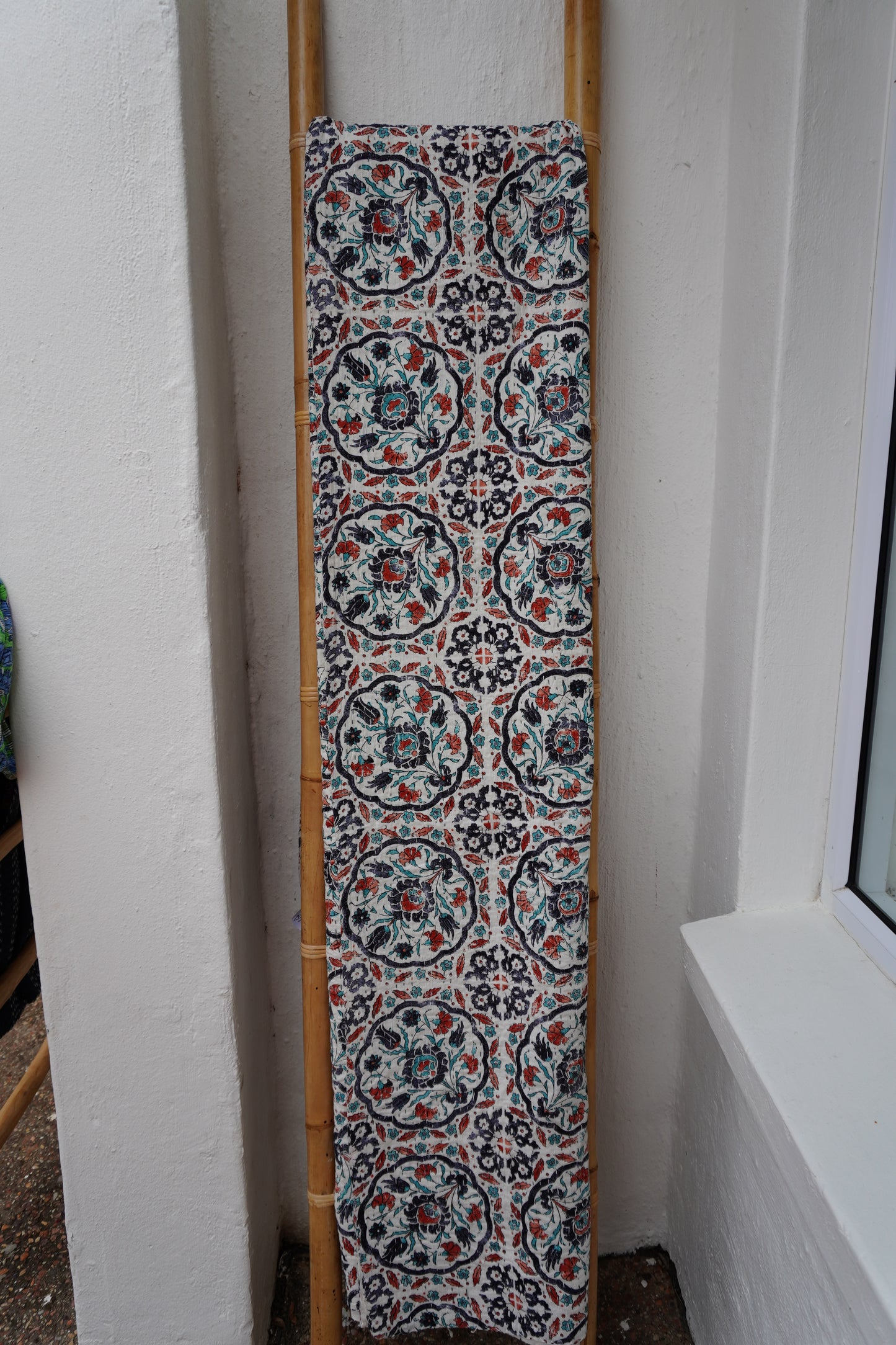 Kantha Quilt in white with RUST AND NAVY FLORALS