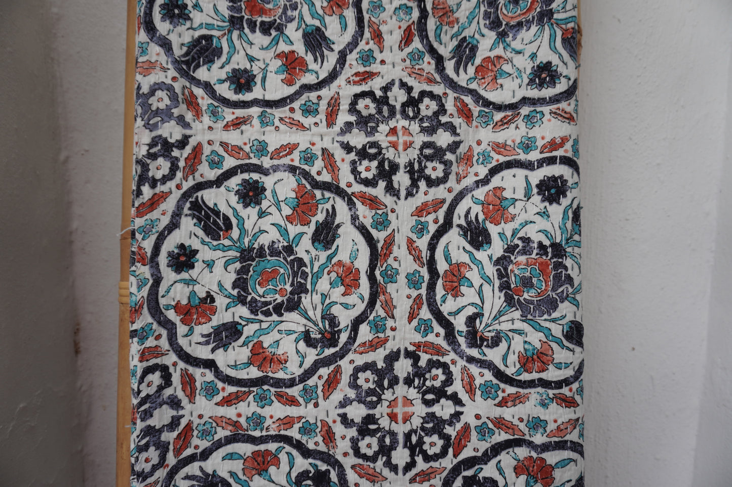 Kantha Quilt in white with RUST AND NAVY FLORALS