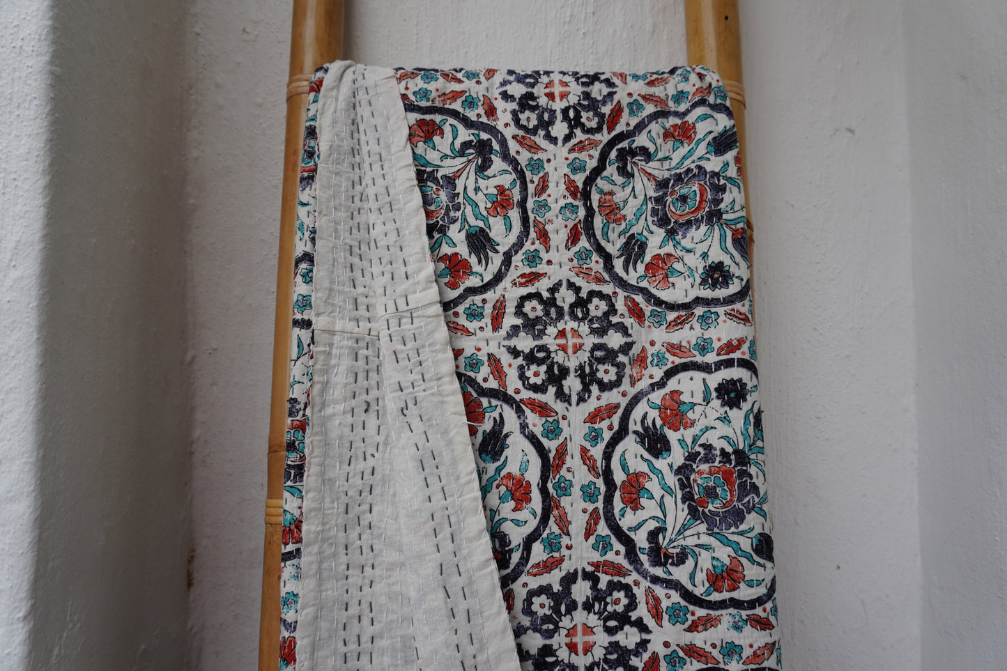 Kantha Quilt in white with RUST AND NAVY FLORALS