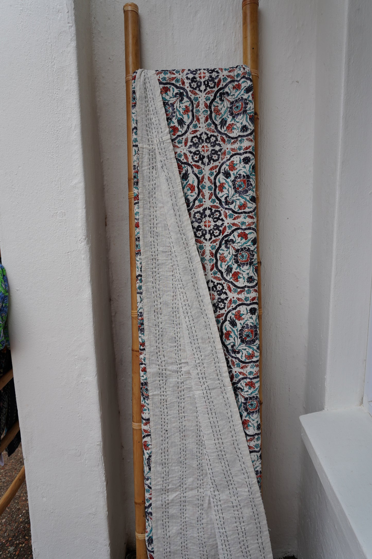 Kantha Quilt in white with RUST AND NAVY FLORALS