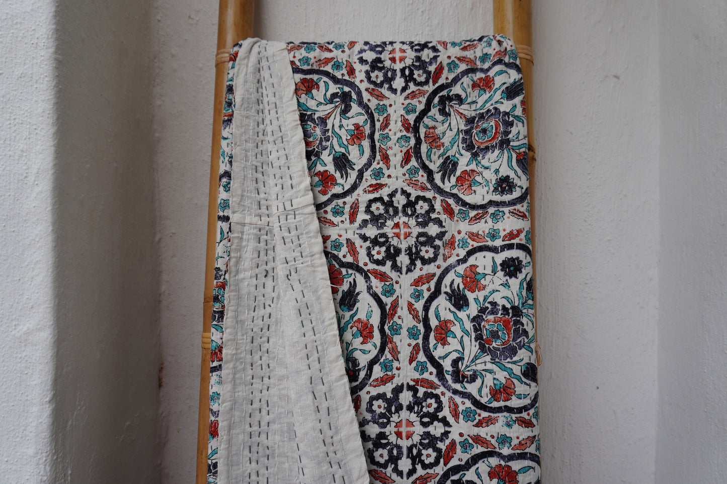 Kantha Quilt in white with RUST AND NAVY FLORALS