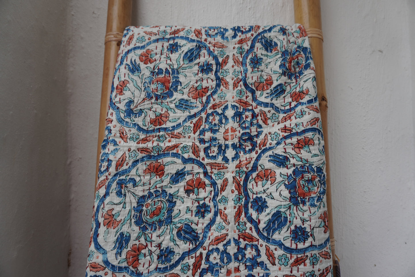Kantha Quilt in white with RUST AND NAVY FLORALS